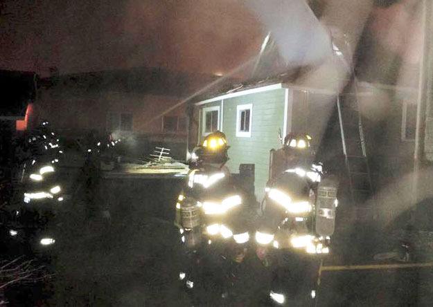 Firefighters battle a house fire in North Renton Jan. 8.