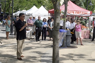 Mayor Denis Law kicks off the opening of the Renton Farmers Market Tuesday at the Piazza in downtown Renton.