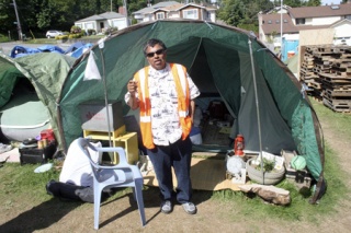 Jose Rosalez' job at Nickelsville tent city in Skyway is to keep track of everyone. He's one of the residents getting ready for the move back to Seattle on Friday.