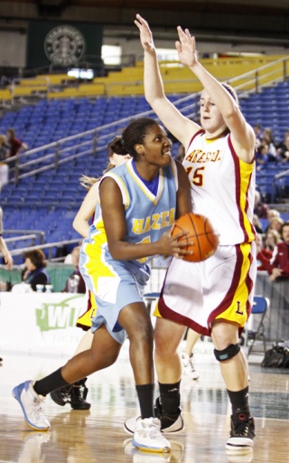 Hazen's Darralita Taylor drives through Lakeside's Morgan Merriman for two points Wednesday afternoon in the opening round of the state 3A girls basketball tournament. Hazen lost the game