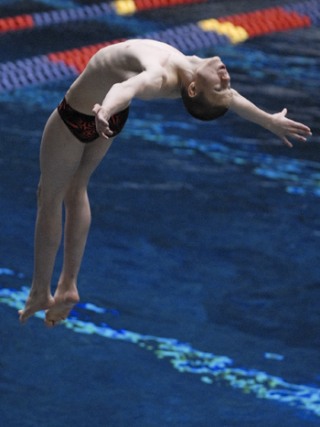 Hazen's Alex Klemetsen competes in the one meter dive event at the Washington State boys 3A swim championship at the King County Aquatic Center in Federal Way on Feb. 21.