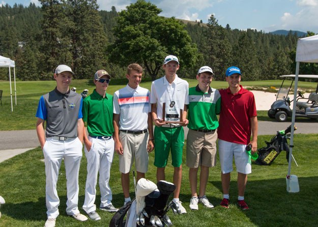 Members of the Liberty golf team pose with their second-place trophy.