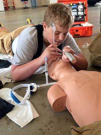 South King County Explorer Bryson Nelson practices advanced life-support skills during the 2015 Fire Muster in Renton May 16.