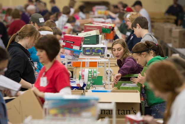Volunteers pack Operation Christmas Child boxes.