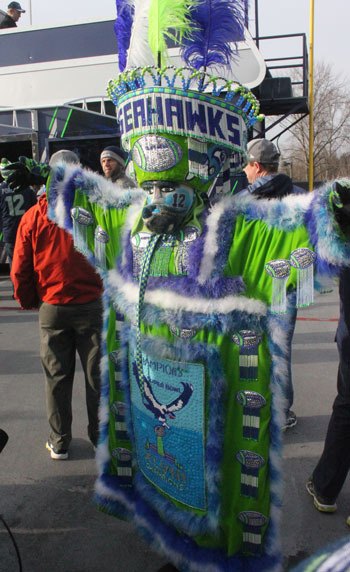 It took Efren de Jesus of Renton one month to put together his costume. He was one of more than a thousand people who attended the playoff rally at Renton City Hall Friday.