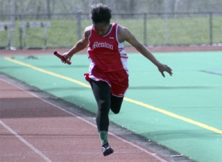 Renton's Taylor Williams crosses the finish line as the anchor of the Indians' 4X200 relay at a meet earlier this season.
