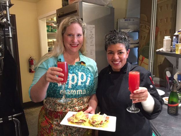 Columnist Carolyn Ossorio and Peyrassol Head Chef Sacha Tinsley pose for a photo after making eggs Benedict.