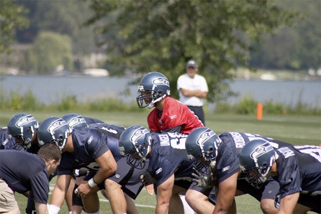 Seneca Wallace waits for a snap under center at the Seahawk's mini camp June 11.