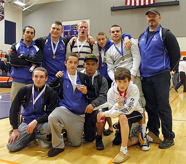The Hazen wrestling team after the regional tournament. From row left to right: Daniel Karpman