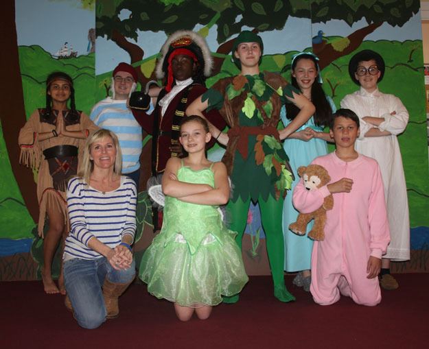 Renton Christian School Drama Director Laura McGinnis with the cast of the school's 'Peter Pan