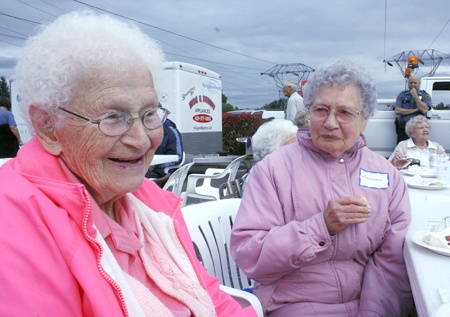 Wilma Hauck (left) and Frances Augustin (right) were among about 200 who attended the Cascade community picnic July 8. It was one of about 18 neighborhood picnics planned for the summer.