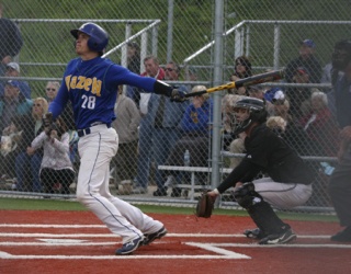 Hazen's Justin Jacobs hits a grand slam to bring the Highlanders back from a 5-2 deficit against Bonney Lake Friday.