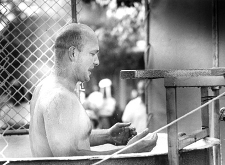 Coach and teacher Rick McGrath gets out of a dunk tank at Hazen High School's 25th anniversary celebration in 1993.