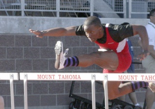 Renton's Tevin Ponders clears a hurdle in the 110-meter race. Ponders finished fourth in the state.