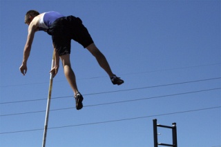 Hazen's Jeff Hinckley soars through the air during the pole vault. Hinckley finished second in the state.