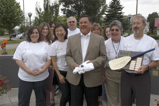 Mayor Denis Law is joined by other city employees to mark the winning of a Well City Award.