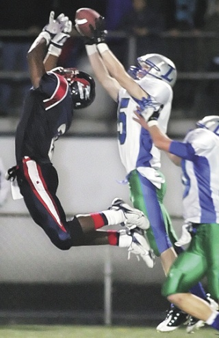 Liberty’s Taylor Hamann intercepts a pass intended for Kennedy’s  Tre Watson. The turnover sealed a win for Liberty.