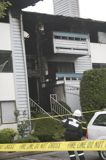 Investigators were at the scene Friday morning of a two-alarm apartment fire in the Highlands that sent two people to Harborview Medical Center and displaced several families at the Heritage Grove Apartments.