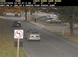 One of the three photos  included with my speeding ticket issued by Renton’s Photo Enforcement Program. The bar across the top gives details of the violation