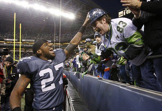 Seahawks' safety Jordan Babineaux celebrates with fans after beating New Orleans Jan. 8.