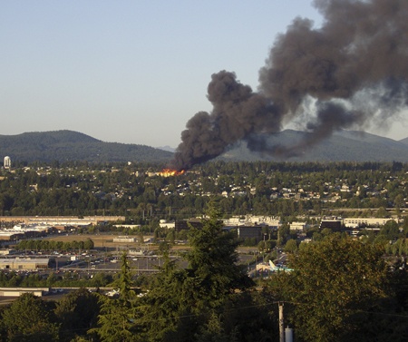 Nancy Yee submitted this photo of the Harrington Square Apartment fire Tuesday night to the Renton Reporter. It was shot from Skyway; in between is part of the Renton Boeing plant. Note the glow of the flames from miles away.