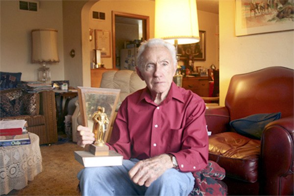 Legendary Renton High School Coach Irv Leifer was photographed in 2011 in his Highlands home by the Renton Reporter for a story for the 100th anniversary of Renton High. BELOW: Coach Leifer
