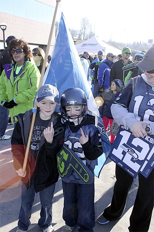 Serious Seahawks fans and brothers Joey and Ethan McCarty attend a Friday afternoon rally at Renton City Hall with their mom