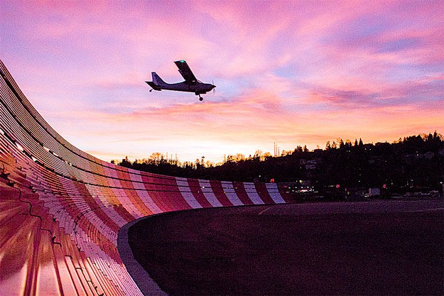 A small plane lands over the new blast wall at Renton Municipal Airport in front of a gorgeous sunset last week.