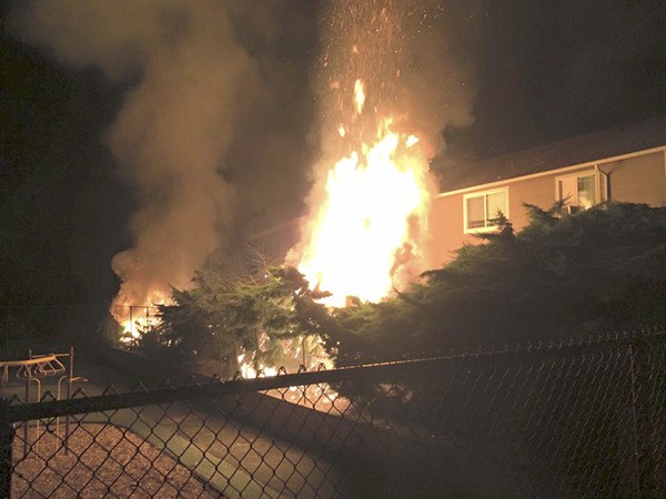 Renton and Tukwila firefighters joined crews from Fire District 20 on West Hill to fight this brush fire July 4 at the Greentree apartments. BELOW:  Fire district crews battled a large brush fire in the 6600 block of South 128th Street caused by legal fireworks.