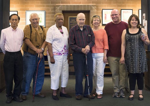 Past member of the Renton Municipal Arts Commission pose for a photo during the group's 50th anniversary celebration.