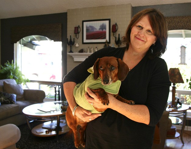 Nancy Heintz holds her dog Rex