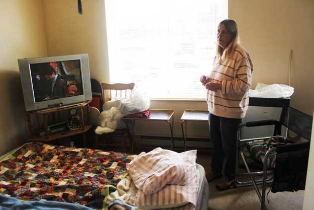 Spencer Court resident Carol Sanders shows the condition of his room since a bed bug infestation hit the facility in July. Carol and her husband Ken have been sleeping on an air mattress.