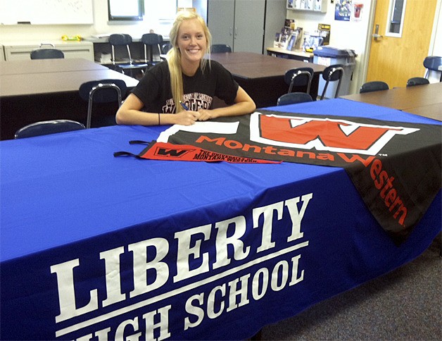 Liberty's Aspen Winegar signs her Letter of Intent to play basketball for the University of Montana Western.
