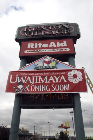 Signs heralding the arrival next month of the new Uwajimaya store went up Tuesday at the Renton Village Shopping Center. The store is replacing the Thriftway that closed last month.
