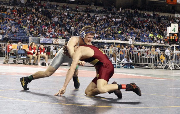 Liberty's Hamilton Noel takes on Enumclaw's Ryan Anderson in the first round of the 3A state wrestling tournament.