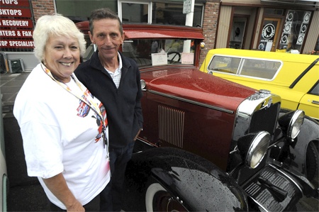 Meri England and Don Hanson in front of his 1929 Chevy at the Return to Renton Car Show. This year it attracted about 3