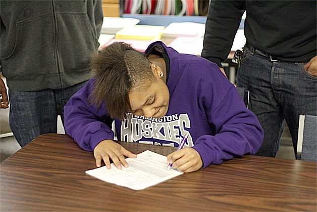 Hazen's Airashay Rogers signs her Letter of Intent to play basketball at the University of Washington Nov. 21.