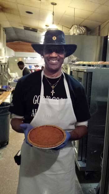 Ezell Stephens poses with a sweet potato pie.