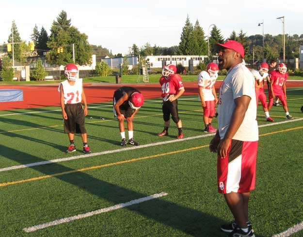 Renton football coach Donald Ponds fires up his team during workouts this week in preparation for the season opener Friday vs. Olympic.