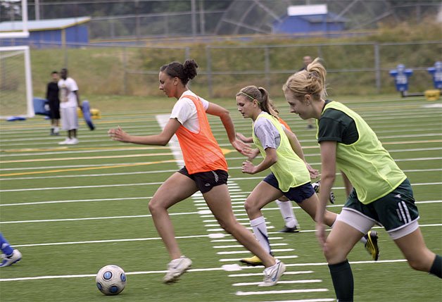 Hazen's Kayla Hackman dribbles away from Cindy Hanson and Dani Schauer at a summer practice.