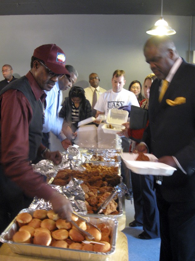 Ezell Stephens serves up fried chicken and sides at the soft-opening of his new business venture Heaven Sent Fried Chicken in downtown Renton. The grand opening was Wednesday