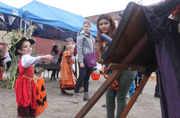 A tiny pirate takes a turn at the ring toss during the annual Olde Fashioned Halloween celebration downtown Oct. 24.
