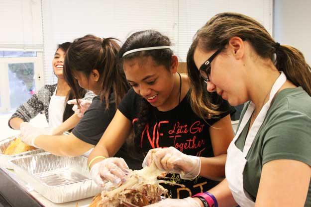 Nelsen Middle School students debone turkeys to give to homeless people in Seattle and Renton.