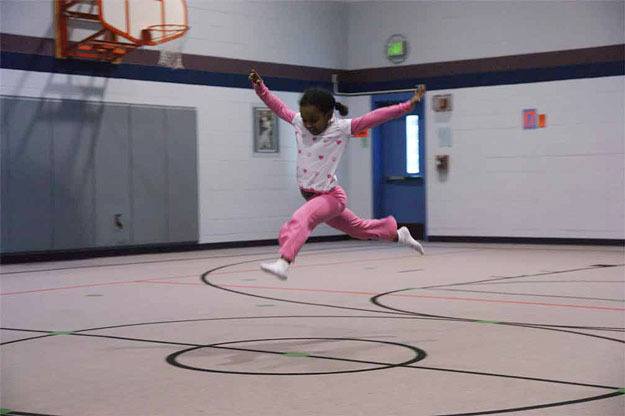A student at Dance ALIVE! leaps through the air at a recent class.