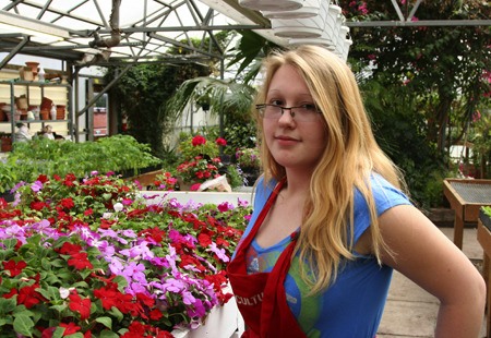 Lindbergh Senior Deseree Moore stands in the greenhouse for the Renton School District's horticulture program
