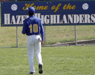 Hazen outfielder Anthony Pina heads back out to the field between innings in Friday's game against Lindbergh.