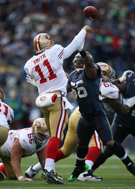 Seahawks linebacker Leroy Hill rushing San Francisco quarterback Alex Smith in a game last season.