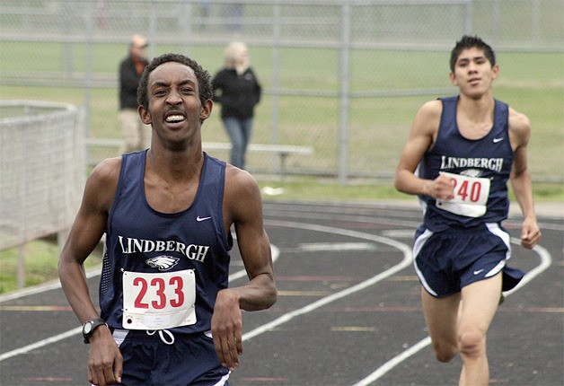 Lindbergh's Luke Garcia chases down teammate Mohamud Abdi near the finish line of the Seamount League meet Oct. 15.