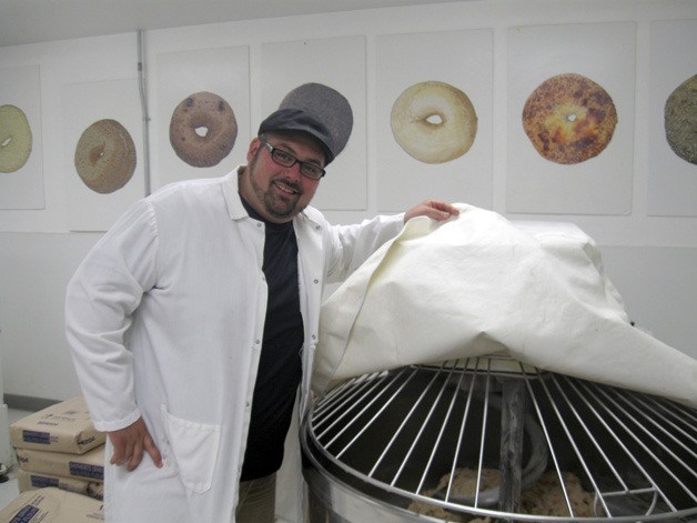 Owner AJ Ghambari shows off part of the cooking process for fresh kettle-boiled bagels from Seattle Bagel Bakery in Tukwila. Seattle Bagel is one of about 60 vendors at this year’s Renton Farmers Market at the Piazza.