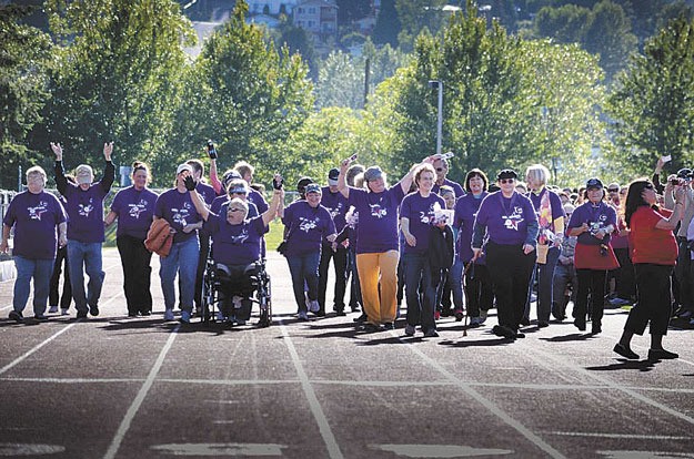 Cancer Survivors take the first lap at the 2013 Relay for Life. This year's event begins tomorrow.